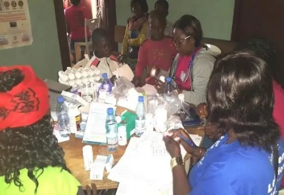 Volunteers at work at a busy table