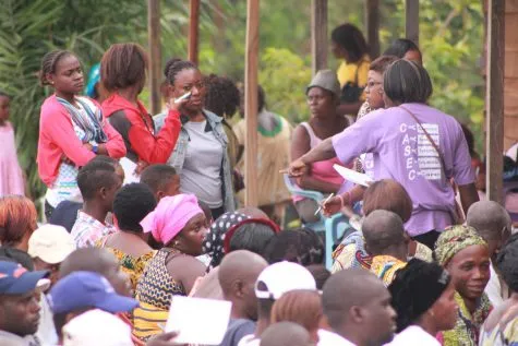 A dense crowd of women waiting outside