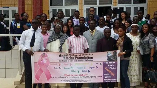 The mission team posing with a Patcha Foundation banner