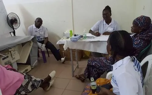 Two volunteers at a consultation room